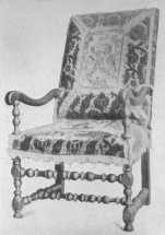 A typical Louis XIII chair, many of which were covered
 with velvet or tapestry.