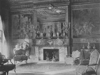 The rare console tables and chairs and the Gobelin
tapestry, "Games of Children," show to great advantage in this
beautifully proportioned room of soft dull gold. The side-and
centre-lights, reflected in the mirror, light the room correctly