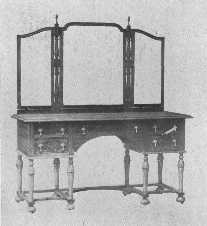 In this walnut dressing-table the period of William and
Mary has been adapted to modern needs.