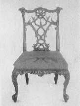 Two important phases of Chippendale's work—an elaborate
ribbon-back chair, and one of the more staid Gothic type.