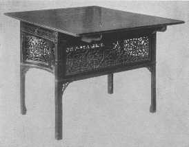 One of the most beautiful examples of Chippendale's
fretwork tea-tables in existence.