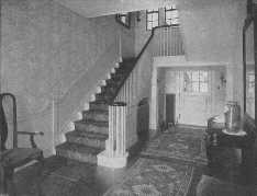 The Oriental rug used on the stairs harmonizes with those
used on the floor.