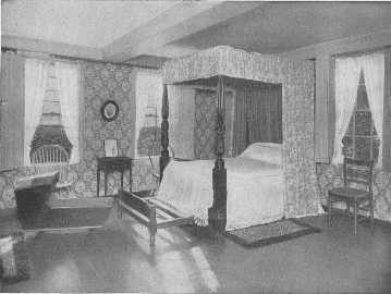 This fine well-curtained four poster, once the property
of Lafayette, the trundle-bed, cradle, chairs and table, are all
interesting, but the wallpaper appears to be of the ugly time of about
1880. Something more appropriate should be chosen.