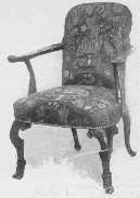 An elaborately carved Chippendale chair, with late Queen
Anne influence in the shape of the back. Petit point covering which was
so popular in her day is now wonderfully reproduced.