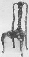 This fine example of a Queen Anne lacquered chair shows
the characteristic splat and top curve, the slip seat narrower at the
back than front with rounded corners, and cabriole legs.