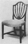 Notice the curved seat of this Hepplewhite chair.