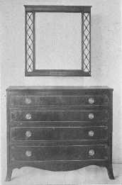 An exceptionally fine reproduction of a Sheraton chest of
drawers.