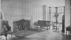 This is in reality a moderate-sized room, yet the open
arrangement and the clear center give the impression of great space. The
curve of the fireplace and the oak panelling are simple Tudor. The
furniture is a mixture of many kinds.